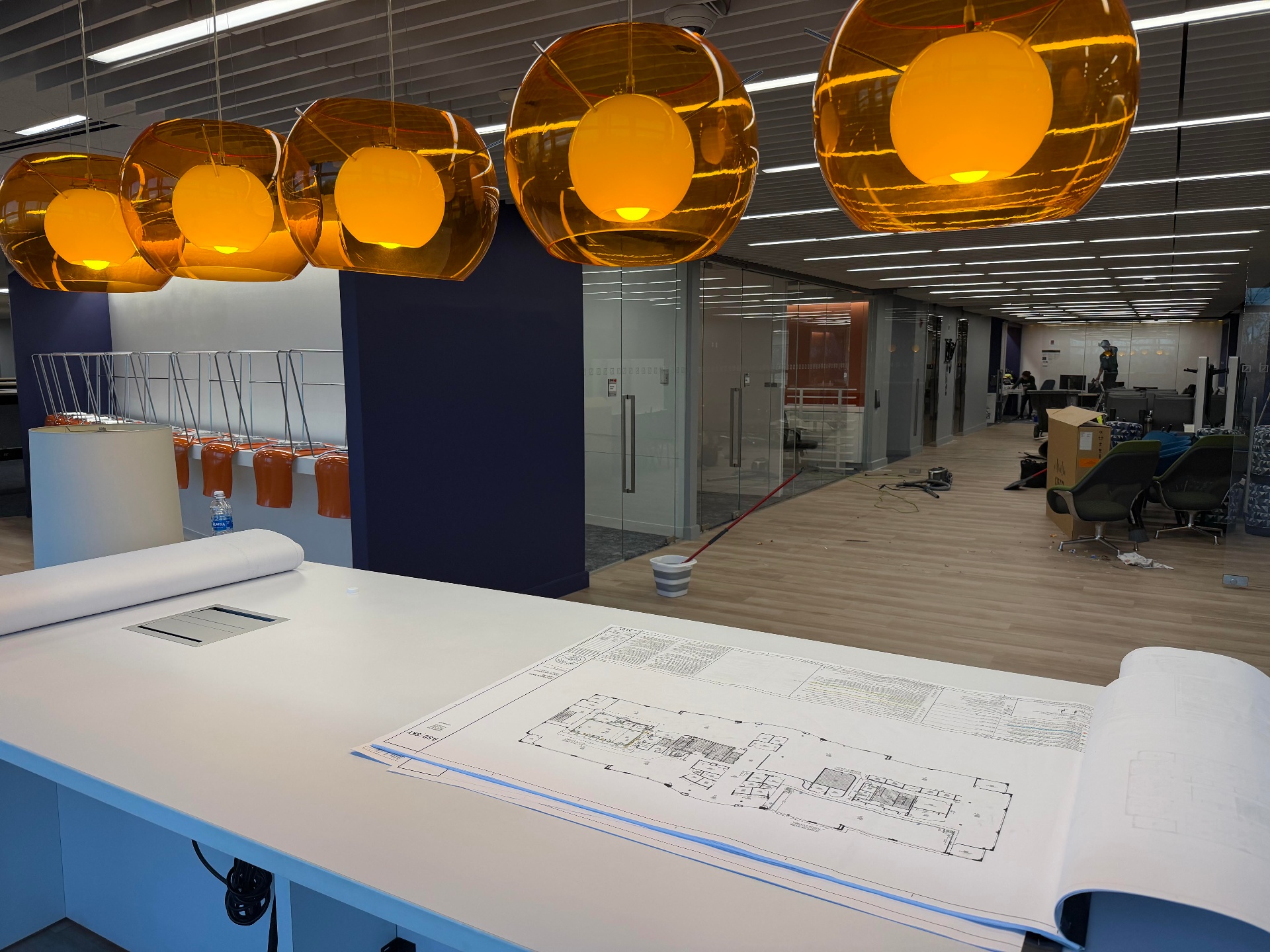 Construction blueprint laid out on a project site planning table