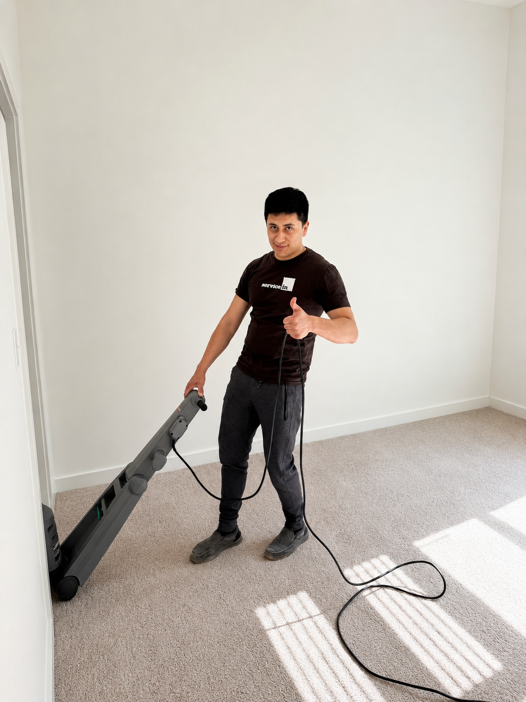 Leo Loso performing carpet cleaning in Service In uniform